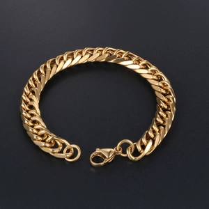 Sleek minimalist golden stainless steel Cuban link bracelet for men and women on black background