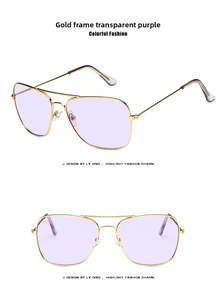 Detail of gold metal frame and transparent purple lenses on retro square sunglasses