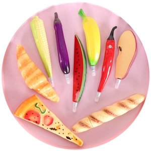 Set of 9 creative food-shaped ballpoint pens including fruits and vegetables on a plate