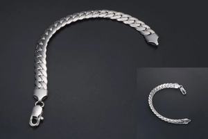 Close-up of silver stainless steel Cuban link bracelet with lobster clasp mechanism