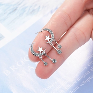 Sparkling silver moon and star drop earrings with cubic zirconia fringe dangles