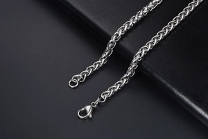 Close-up of a silver stainless steel dragon bone chain with a lobster clasp closure