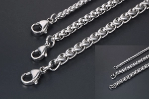 Detailed close-up of three silver stainless steel keel chains with lobster clasps