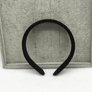 Close-up of 2.5cm black velvet headband showing soft fabric texture and simple design