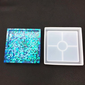 Detail of square silicone coaster mold with blue holographic resin DIY craft piece