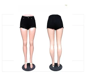 Detailed front and back views of black high-waisted denim shorts with frayed edges