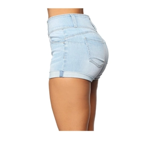 Detail of high-waisted light blue denim shorts featuring rolled cuffs and side view fit