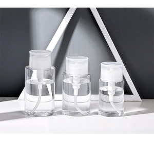Three clear plastic press bottles for liquids in small, medium, and large travel sizes