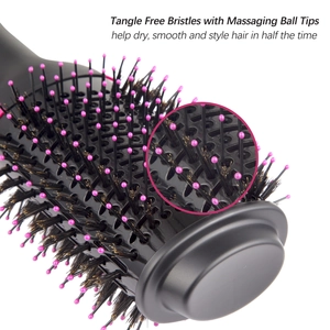 Detail of tangle-free bristles and pink massaging ball tips on hot air hair brush