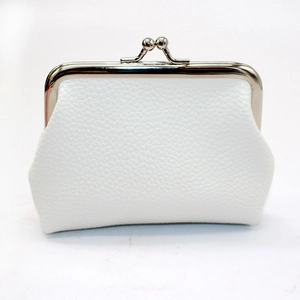 Detailed view of white PU leather coin purse with lychee texture and silver kiss lock