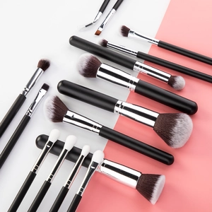 Macro view of professional 15pcs makeup brush set with wooden handles and silver ferrule