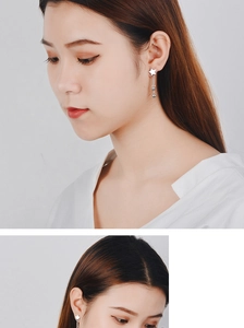 Detail of silver star earrings with long chain tassels and small beads for women