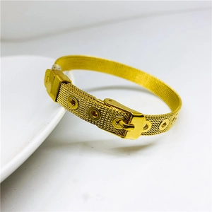 Detailed view of the gold mesh weave pattern and adjustable belt buckle on the MOM bracelet