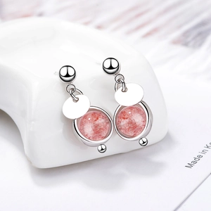 Minimalist pink strawberry quartz drop earrings in silver setting on white stand