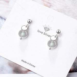 Elegant strawberry quartz disc earrings with silver metal finish on display card