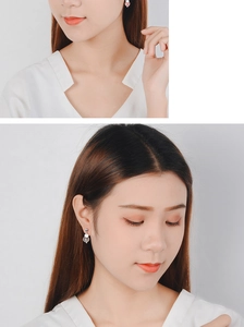 On-model view showing pink strawberry quartz disc earrings with silver hooks for women