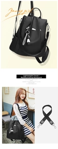 Detail of waterproof black oxford backpack with detachable straps and teddy bear charm