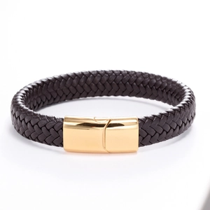 Close-up of braided dark brown leather bracelet with polished gold-toned magnetic clasp