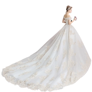 Elegant ivory off-shoulder bridal gown with luxury lace embroidery and long royal train