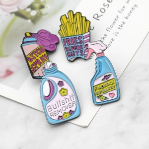 Funny laundry detergent and fries enamel brooch pins set on marble background