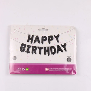 13-piece set of 16-inch black foil balloons forming HAPPY BIRTHDAY in retail packaging