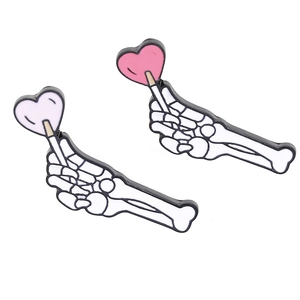 Creative punk couple brooch featuring skeleton hand holding heart lollipop design