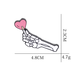 Cartoon skeleton hand holding pink heart lollipop enamel pin with 4.8cm size detail