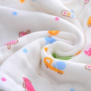 Close-up of 6-layer high-density soft cotton gauze towel with colorful cartoon patterns