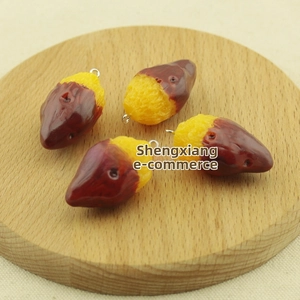 Detailed macro view of four realistic resin roasted sweet potato charms for DIY crafts