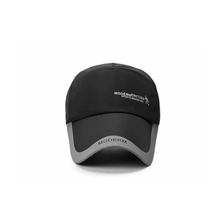 Close-up of black and grey sports baseball cap with Modern British Sports embroidery