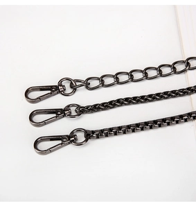 Close-up of three gunmetal replacement chain straps with rotating lobster clasps