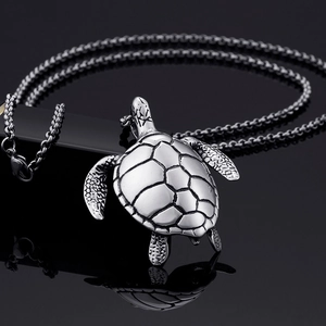 Polished stainless steel sea turtle pendant necklace with detailed shell texture for men