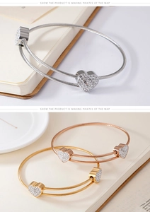 Detailed view of heart-shaped crystal bracelets in silver, gold, and rose gold steel