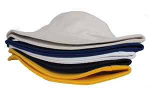 Detailed stack of cotton bucket hats in beige navy white black and yellow colors