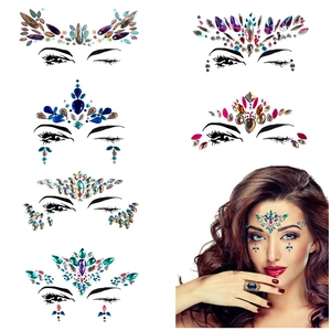Detailed view of colorful rhinestone face gems set for forehead and eye makeup decoration