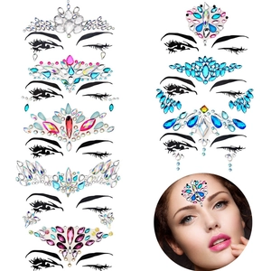 Detailed close-up of crystal facial jewelry stickers with colorful rhinestone designs
