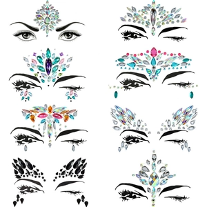 Detailed grid view of eight assorted face rhinestone sticker designs in various colors