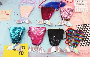 Detailed flat lay of mermaid tail sequin coin purses in seven assorted vibrant colors