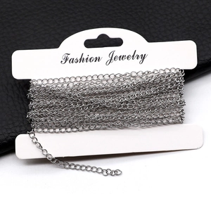Silver stainless steel extension chains for necklaces and bracelets on a card