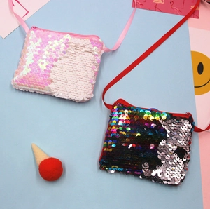 Detail view of colorful sequin mini purses for kids with shoulder straps and zippers