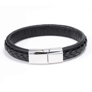 Close-up of black braided leather bracelet with a polished stainless steel metal clasp