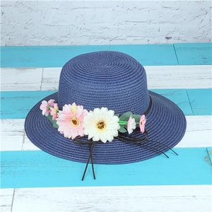 Navy blue straw sun hat for women with pink daisy flowers and bow for beach outings