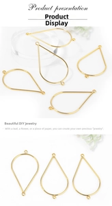 Close-up of golden teardrop hollow metal pendants for DIY jewelry making