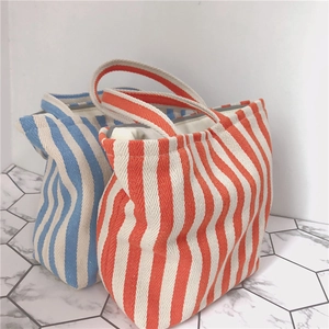 Minimalist striped canvas tote bag with top handles in orange and blue color options