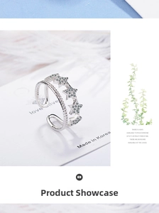 Detail of silver double-layered star ring with cubic zirconia and adjustable band