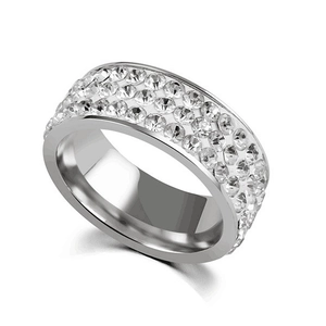 Macro shot of silver titanium steel ring with five rows of sparkling cubic zirconia
