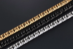 Detailed view of Cuban chain bracelets in gold, black, and silver stainless steel