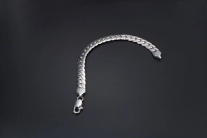 Polished silver stainless steel Cuban link bracelet for men with a secure lobster clasp