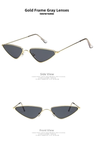 Detail of vintage cat-eye sunglasses with gold metal frame and dark grey lenses