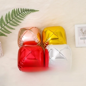 Detail of 10-inch 4D cube aluminum foil balloons in metallic red, silver, and gold colors